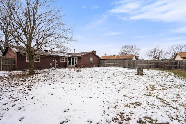 view of snow covered house