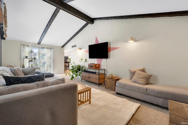 living room with lofted ceiling with beams and carpet flooring