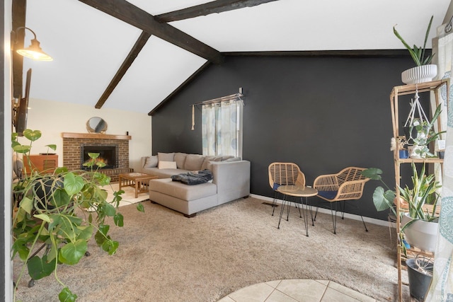 carpeted living room featuring a brick fireplace and vaulted ceiling with beams