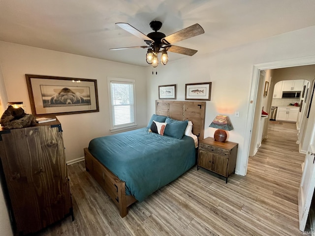 bedroom with ceiling fan and light wood-type flooring