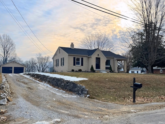 view of front of home featuring a garage and an outdoor structure