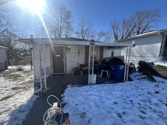 view of snow covered house