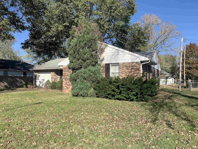 view of side of property featuring a yard