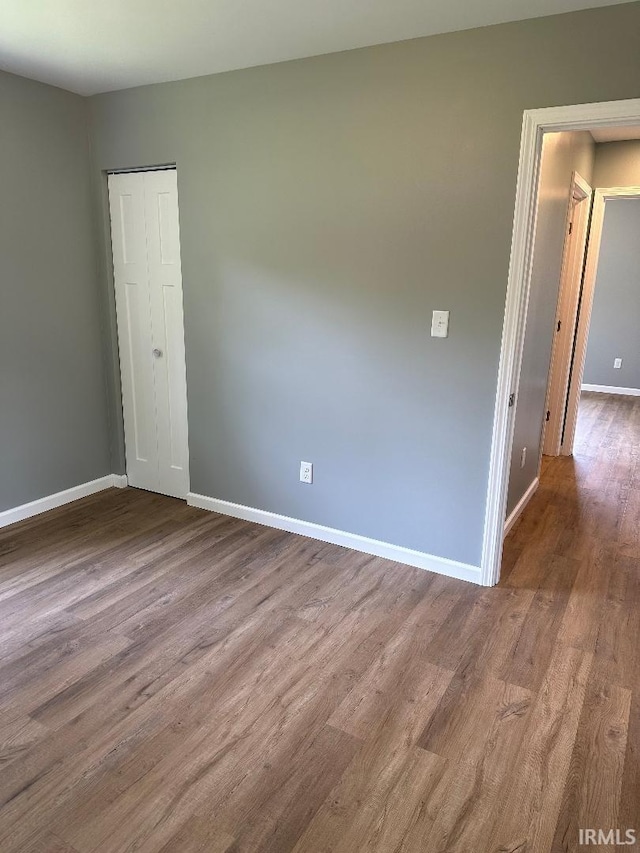 empty room featuring wood-type flooring