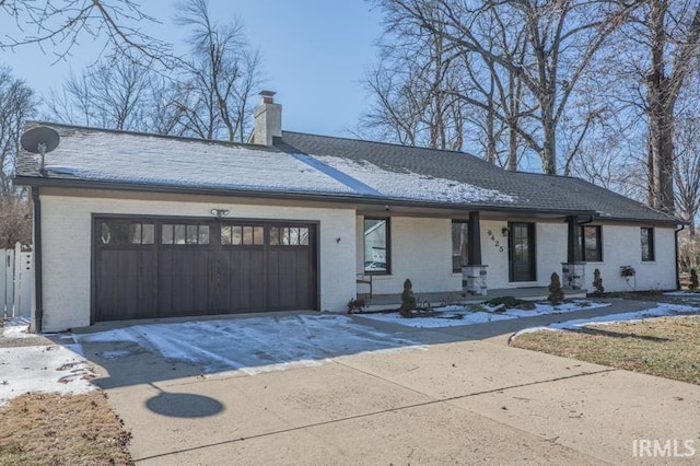 view of front of home featuring a garage and a porch