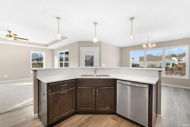 kitchen featuring sink, dark brown cabinets, dishwasher, and plenty of natural light