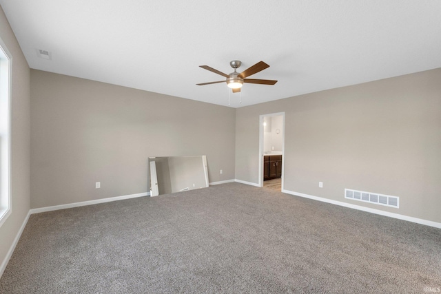 empty room featuring light carpet and ceiling fan