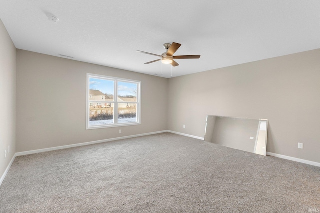 unfurnished room with carpet floors and ceiling fan