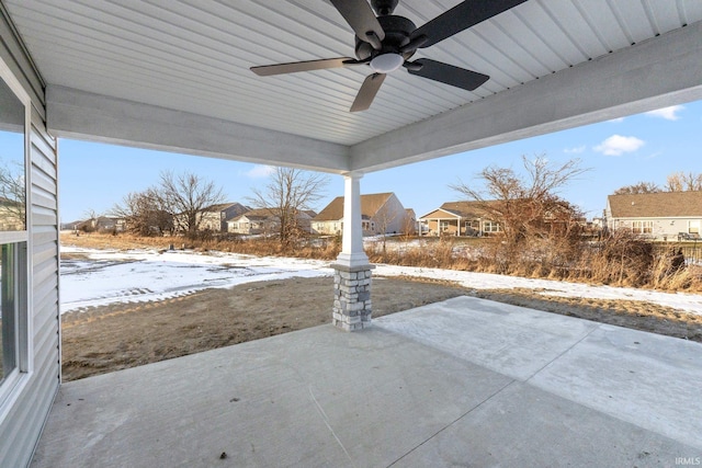 snow covered patio with ceiling fan