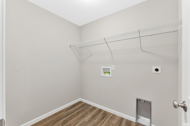 laundry room with dark hardwood / wood-style floors, hookup for a washing machine, and electric dryer hookup