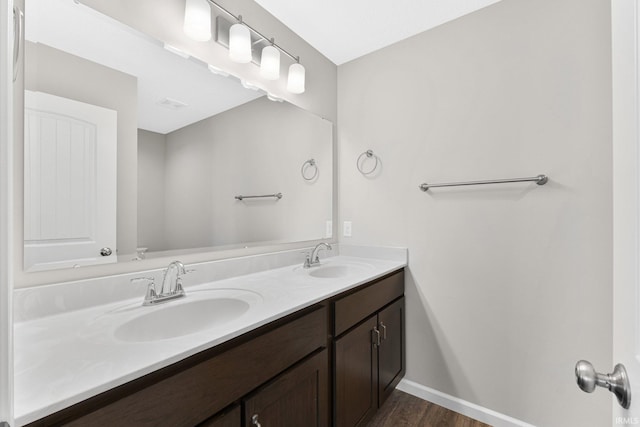 bathroom with vanity and hardwood / wood-style floors