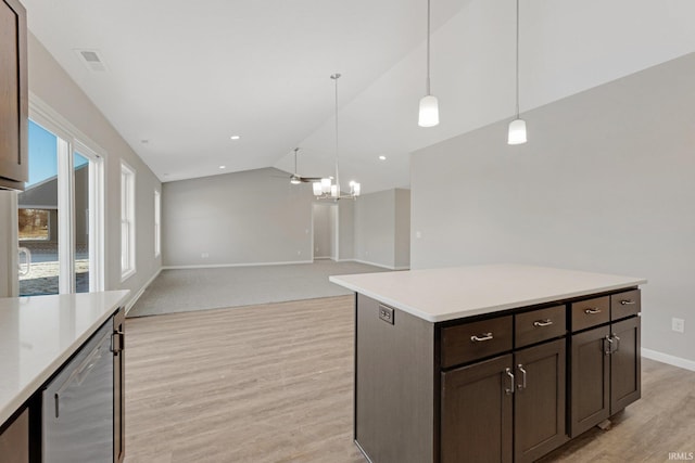 kitchen featuring pendant lighting, lofted ceiling, light hardwood / wood-style flooring, wine cooler, and dark brown cabinetry