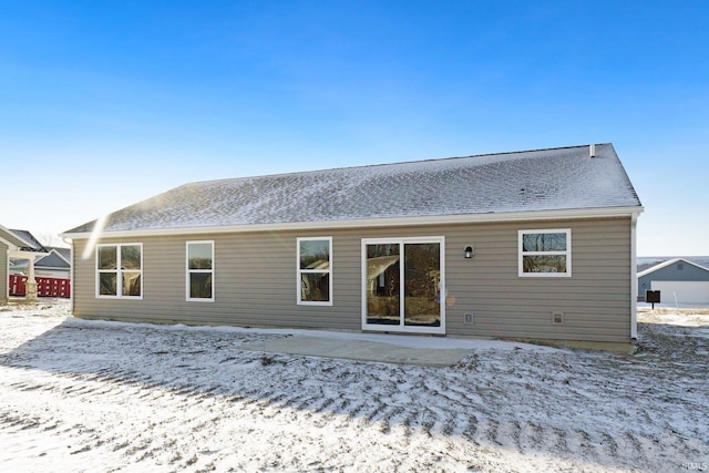 snow covered property featuring a patio