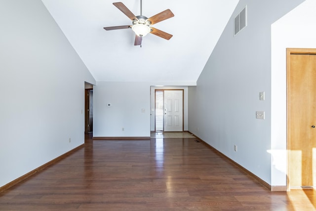 interior space featuring dark wood-type flooring, high vaulted ceiling, and ceiling fan