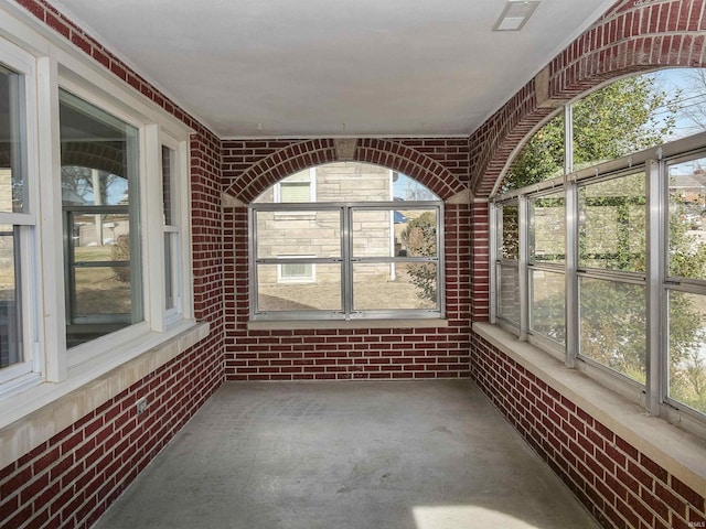 unfurnished sunroom with a wealth of natural light