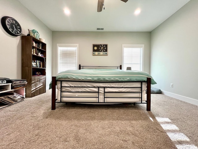 bedroom with ceiling fan and carpet