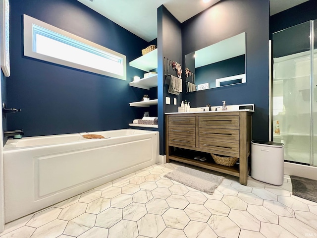 bathroom featuring vanity and separate shower and tub