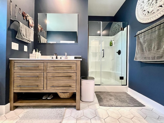 bathroom with walk in shower and vanity