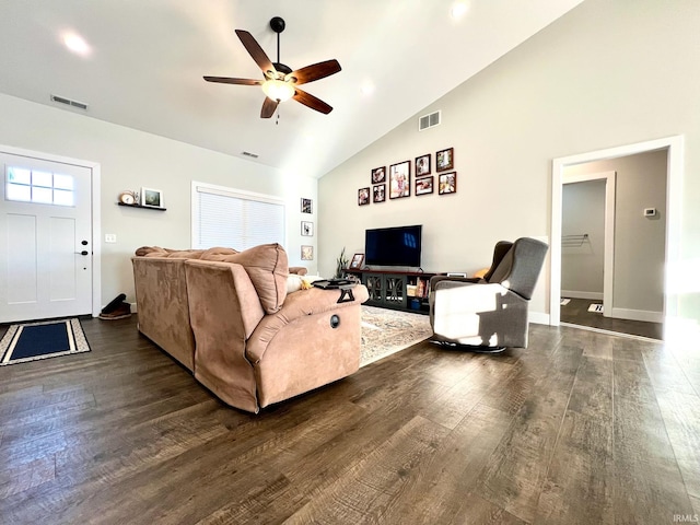 living room featuring dark wood-type flooring, ceiling fan, and vaulted ceiling