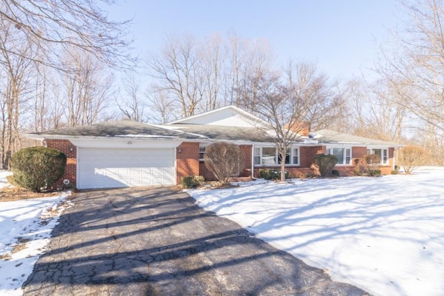 ranch-style house featuring a garage