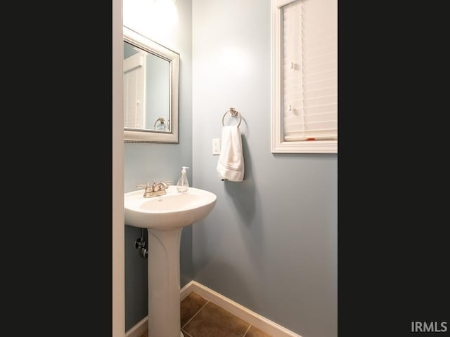 bathroom with tile patterned floors and sink