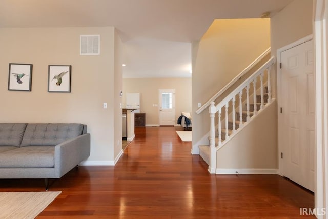 foyer entrance with hardwood / wood-style floors