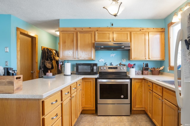 kitchen featuring stainless steel electric range oven, kitchen peninsula, sink, and a textured ceiling