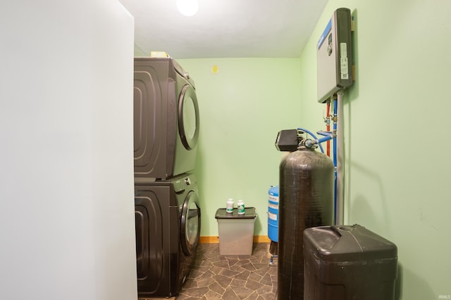 washroom with stacked washer and dryer