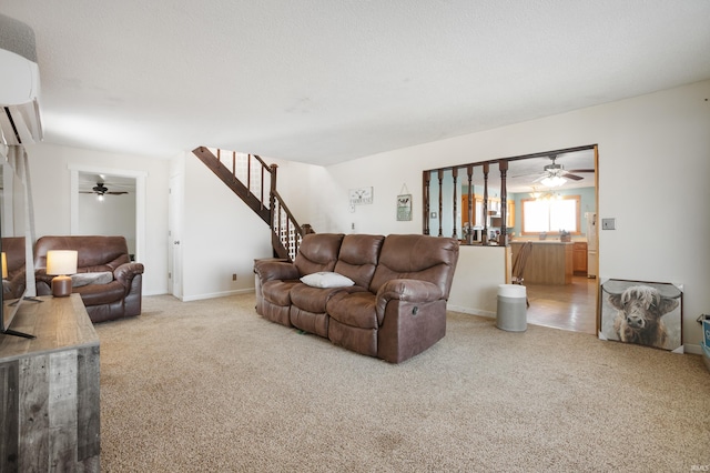 living room featuring carpet flooring and a wall mounted air conditioner