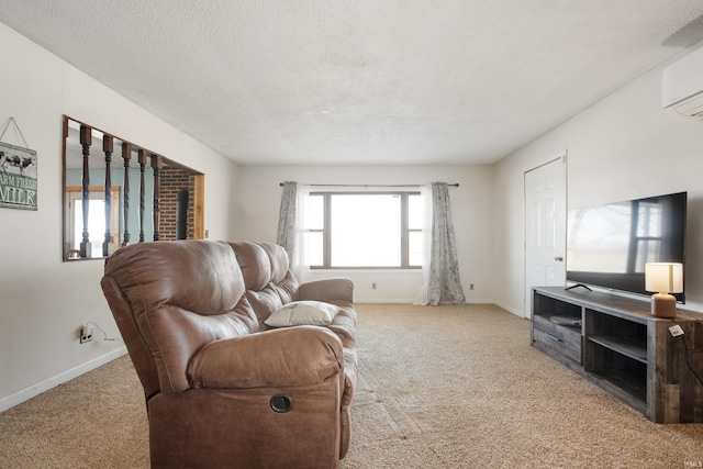 carpeted living room featuring a wall mounted AC and a textured ceiling