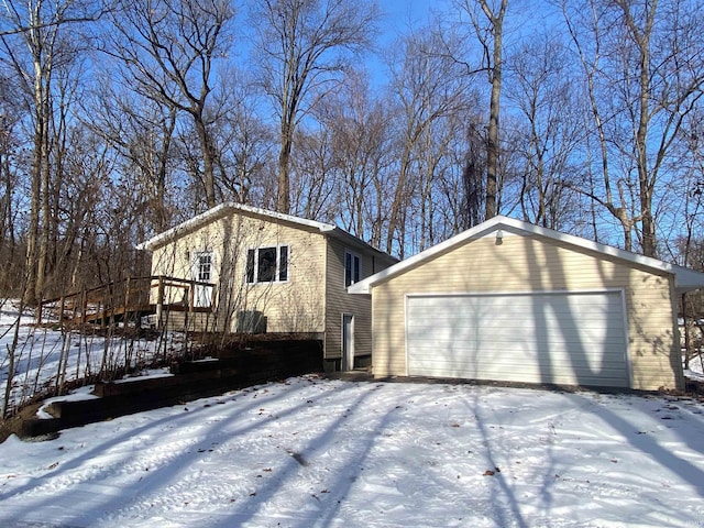 view of front facade featuring an outbuilding and a garage