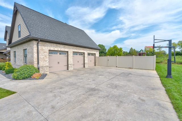 view of side of home featuring a garage