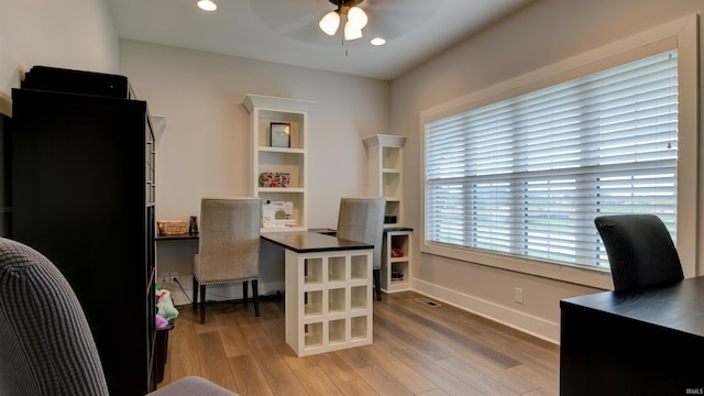 office with ceiling fan and light wood-type flooring