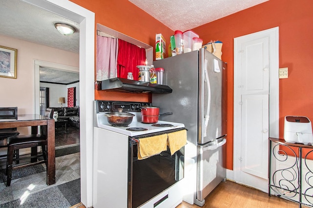 kitchen with stainless steel refrigerator, hardwood / wood-style floors, a textured ceiling, and white range with electric stovetop