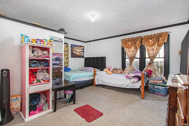 bedroom featuring crown molding, a textured ceiling, and carpet