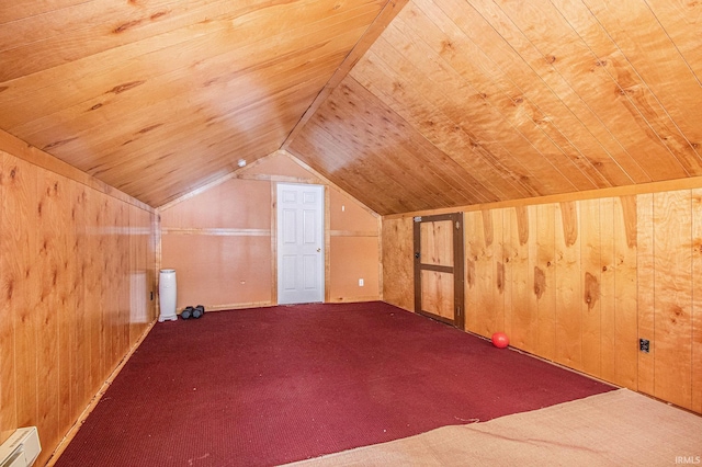 additional living space with lofted ceiling, dark colored carpet, wood ceiling, wooden walls, and a baseboard heating unit