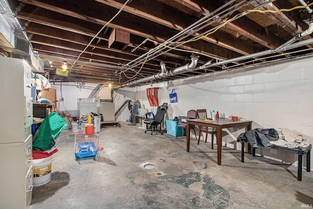 basement with washer and clothes dryer