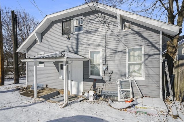 view of snow covered house