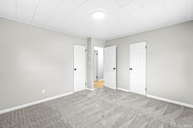 unfurnished bedroom with carpet