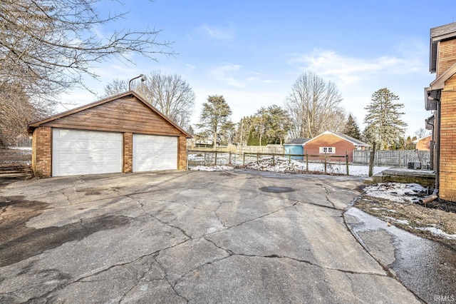 exterior space featuring an outbuilding and a garage