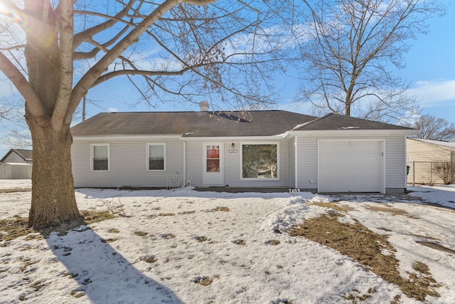 ranch-style house featuring a garage