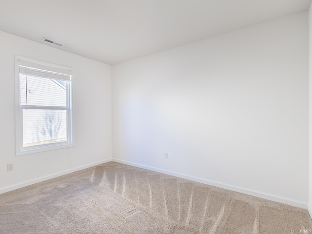 spare room featuring carpet flooring