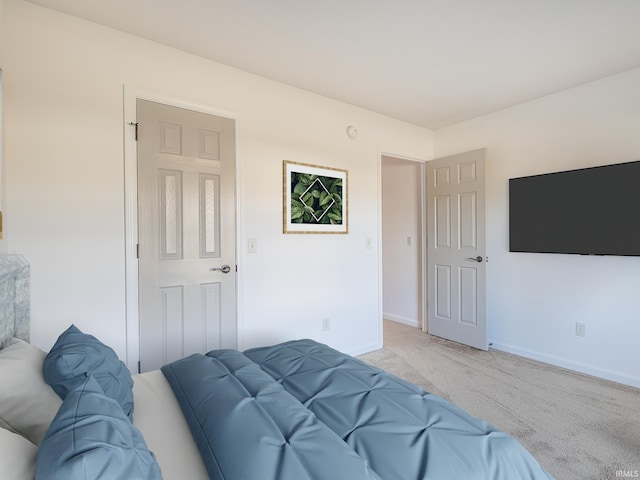 bedroom with light colored carpet