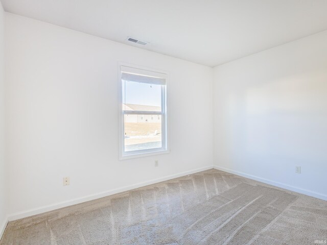 empty room featuring carpet floors