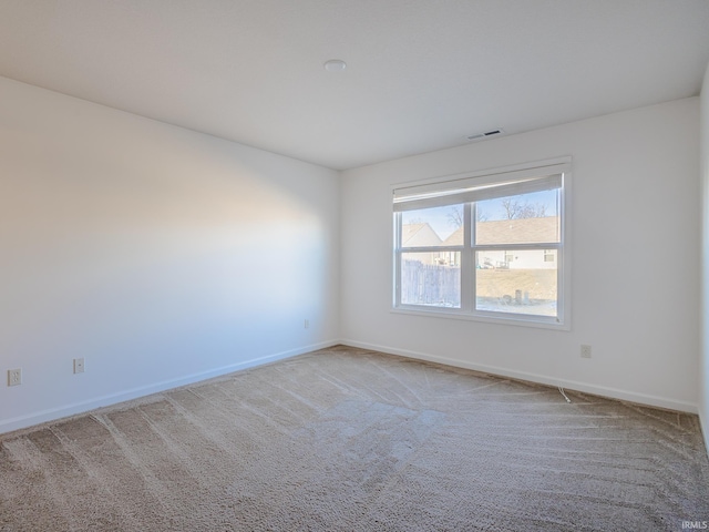 empty room with carpet flooring