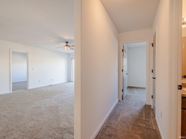 corridor featuring carpet flooring