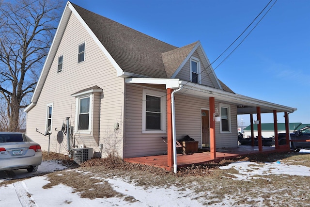 view of front of house featuring a porch and cooling unit