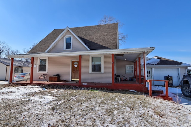 view of front facade featuring a garage and covered porch