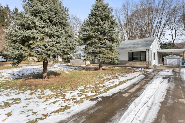 view of front of house with an outbuilding and a garage