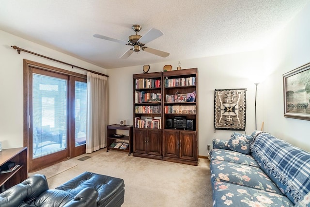4980 N 300 W, Fremont, IN 46737 - sitting room with ceiling fan, a healthy amount of sunlight, light carpet, and a textured ceiling